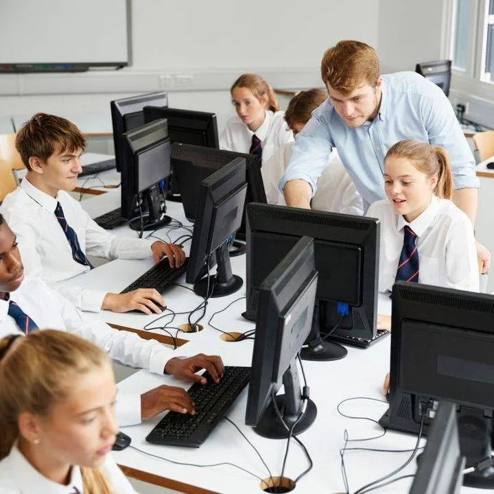 Safeguarding children with SEND - teacher with children in a classroom